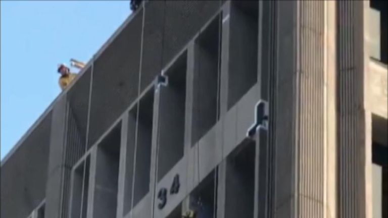 Firefighters perform successful rescue of worker left dangling on side of building in California