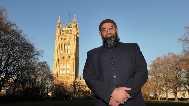 Anjem Choudary posing in front of the Houses of Parliament