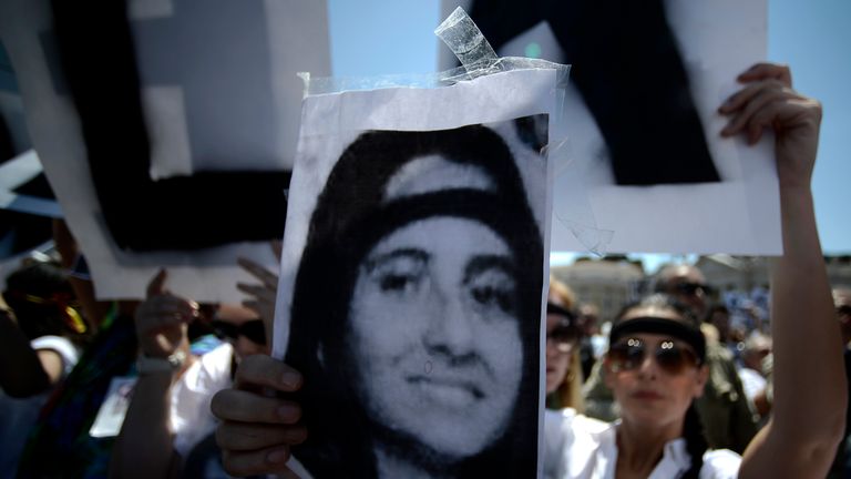A demonstrator holds a poster of Emanuela Orlandi reading &#39;Missing&#39; at a demonstration at the Vatican in 2012