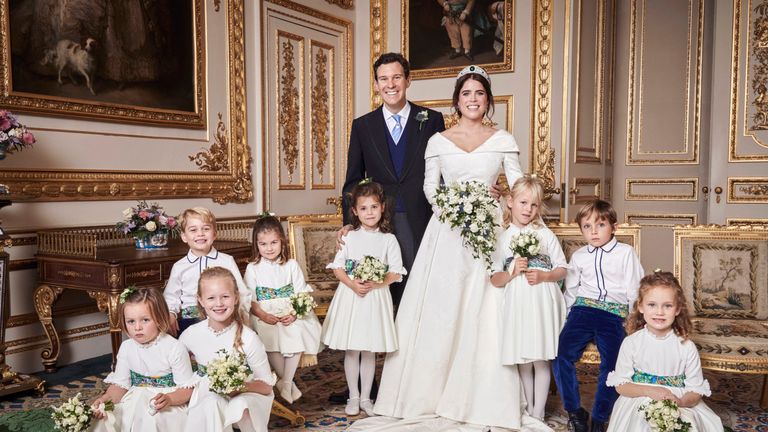 The couple posed with the bridesmaids and pageboys