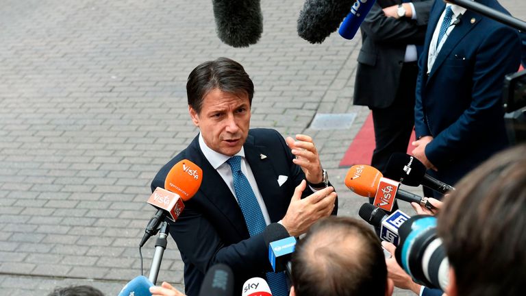 Italy's Prime Minister Giuseppe Conte gestures as he addresses media representatives after an EU - Korea Summit meeting at the European Council in Brussels on October 19, 2018
