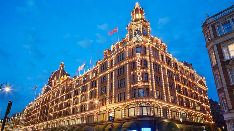 The famous Harrods department store illuminated in the evening of August 8, 2015 in London, UK. Harrods is the biggest department store in Europe.