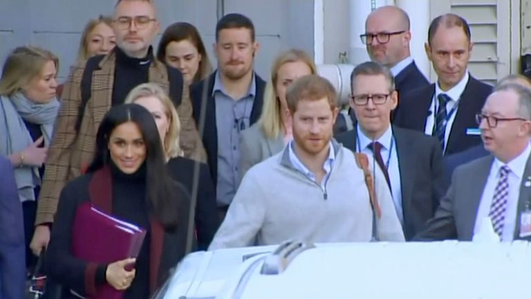 Britain&#39;s Prince Harry, center right, and his wife Meghan, center left, Duke and Duchess of Sussex, approach a car at an airport in Sydney, Monday, Oct. 15, 2018. Prince Harry and his wife Meghan arrived in Sydney on Monday, a day before they officially start a 16-day tour of Australia and the South Pacific.(Australian Pool via AP)