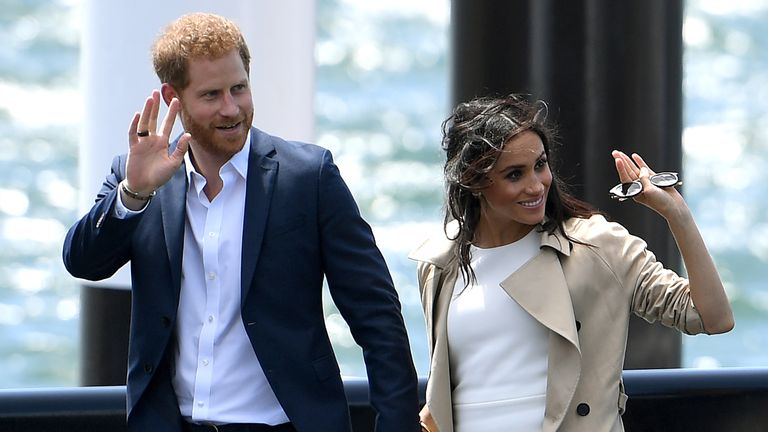 Prince Harry and Meghan arrive for a public walk at the Sydney Opera House 