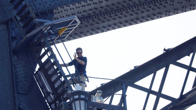 Prince Harry waves as he climbs Sydney Harbour Bridge in Sydney, Australia October 19, 2018