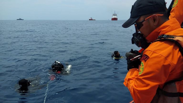 Rescue workers are seen at the site where it is believed the Lion Air flight JT610 crashed