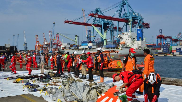 Rescue team members arrange the wreckage, showing part of the logo of Lion Air flight JT610, that crashed into the sea, at Tanjung Priok port in Jakarta, Indonesia, October 29, 2018. REUTERS/Stringer