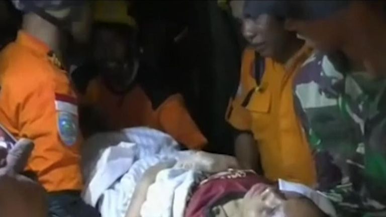 Woman pulled alive from earthquake rubble