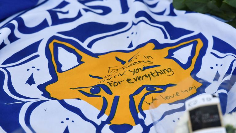 Leicester City fans leave flowers and tributes at the King Power Stadium after a helicopter crash involving Thai owner Vichai Srivaddhanaprabha