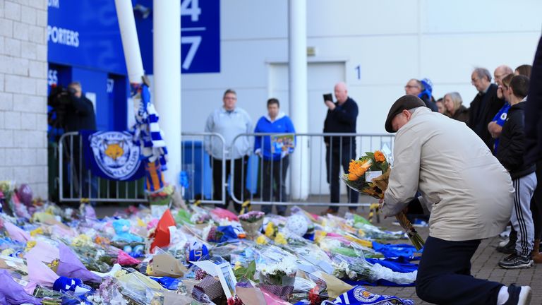 Fan have left flowers and mementos at the club after the crash
