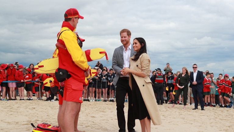 Prince Harry and Meghan visit a beach at Melbourne and join a clean up operation