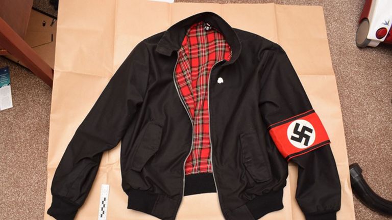 Photo issued by West Midlands Police of a jacket bearing a Swastika armband found during police searches of the home in Oxfordshire, of Adam Thomas and Claudia Patatas