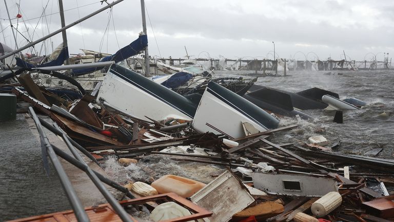 Boats that were docked are seen in a pile of rubble after hurricane Michael passed through the downtown area on October 10, 2018 in Panama City, Florida