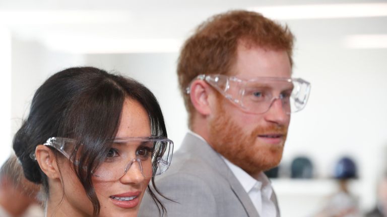 Prince Harry and Meghan, Duchess of Sussex wear protective glasses during a visit to the University of Chichester Tech Park