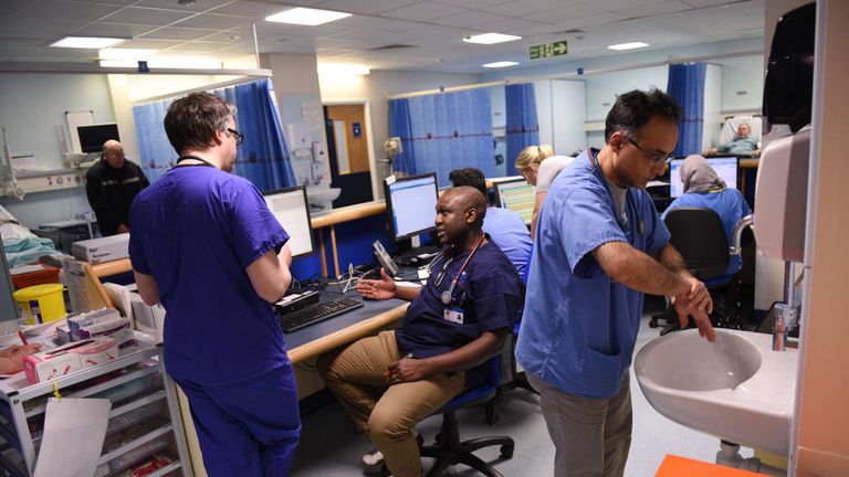Members of clinical staff work at computers in the Accident and Emergency department of the &#39;Royal Albert Edward Infirmary&#39; in Wigan, north west England on April 2, 2015