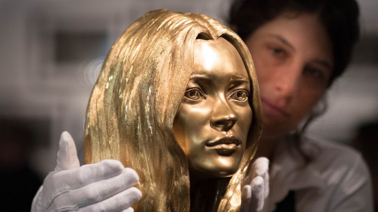 A bust of Kate Moss in solid 18-carat gold by Marc Quinn on show as part of the forthcoming Midas Touch auction, dedicated entirely to gold, Sotheby&#39;s, London