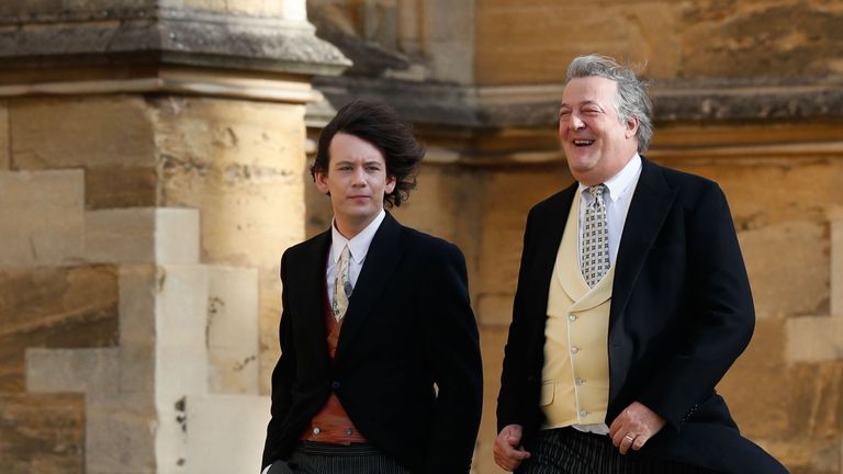 Stephen Fry arrives with his husband comedian Elliott Spencer 