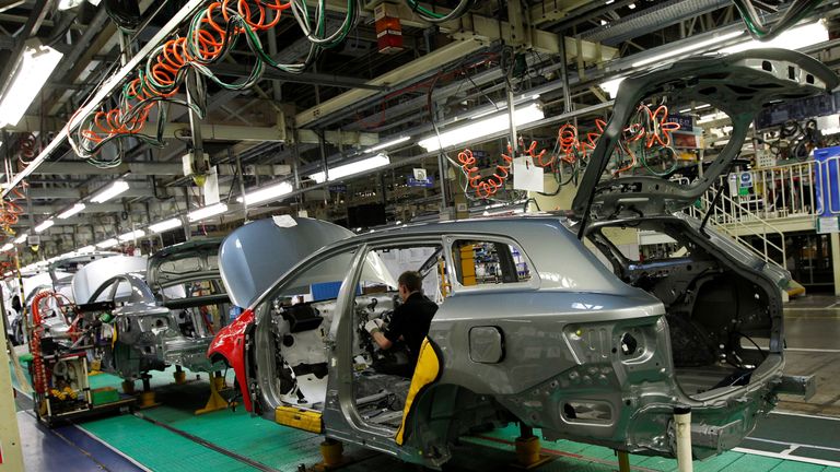A man works on the production line at the Toyota factory in Derby