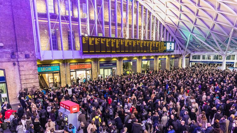 LONDON, UK - FEBRUARY 23, 2017: Crowded Kings Cross station in the city. Hundreds people waiting for the train, with delays and cancellations as Storm Doris lashes UK
