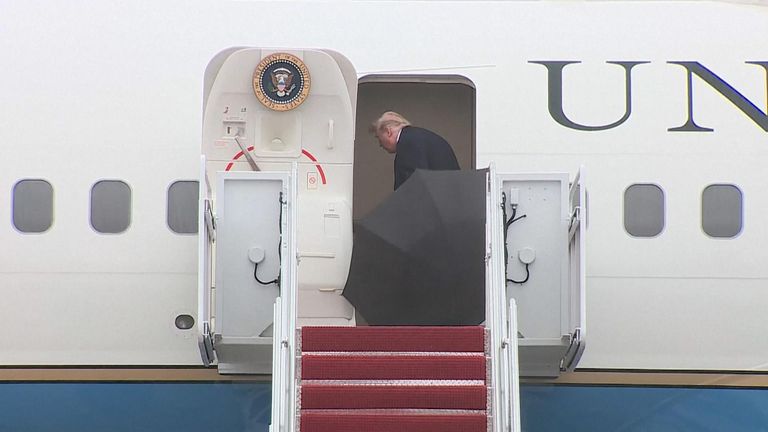 President Trump couldn&#39;t get his umbrella through the door of Air Force One - so he dumped it.