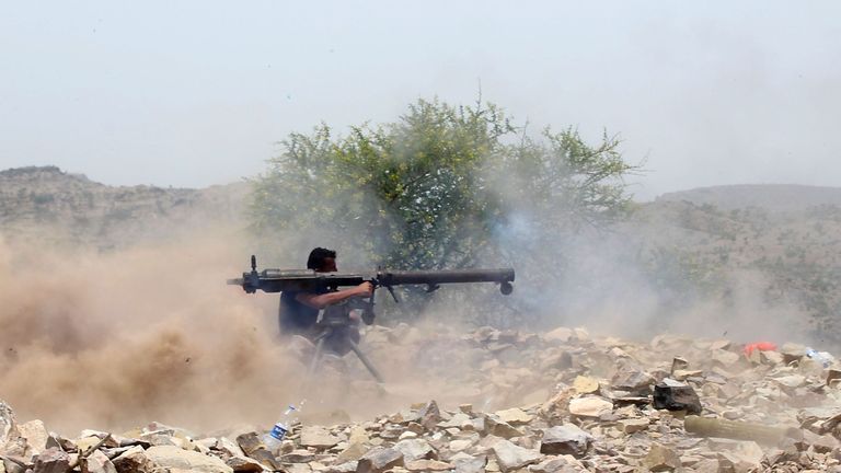 A Yemeni pro-government fighter with UAE-supported forces fires a rocket launcher on the frontline of Kirsh, southwestern Yemen