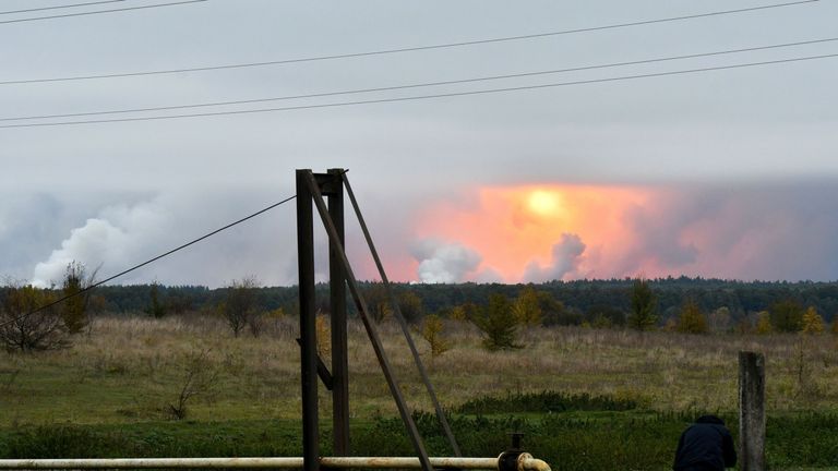 A fireball can be seen in the sky after explosions at the ammunition depot in north Ukraine