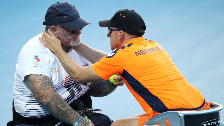 Paul Guest of the Unconquered team is comforted by his playing partner Edwin Vermetten of the Unconquered as they compete in the Open Doubles Wheelchair Tennis Final match
