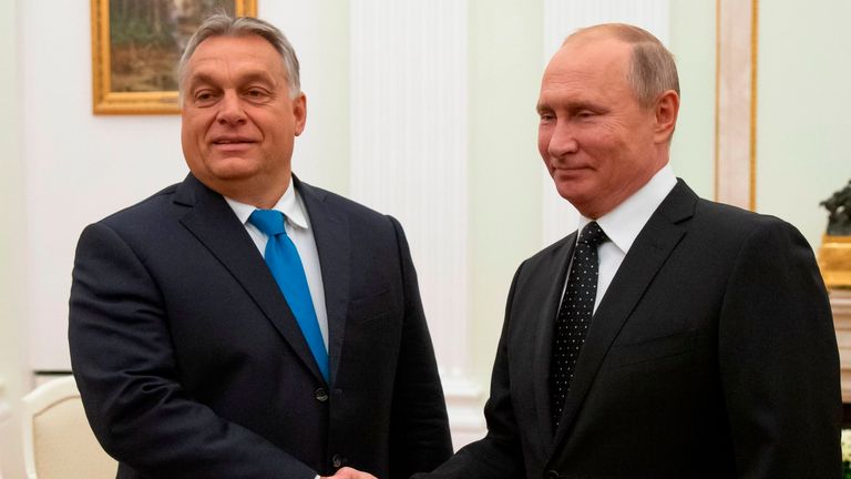 Hungarian Prime Minister Viktor Orban (L) shakes hands with Russian President Vladimir Putin