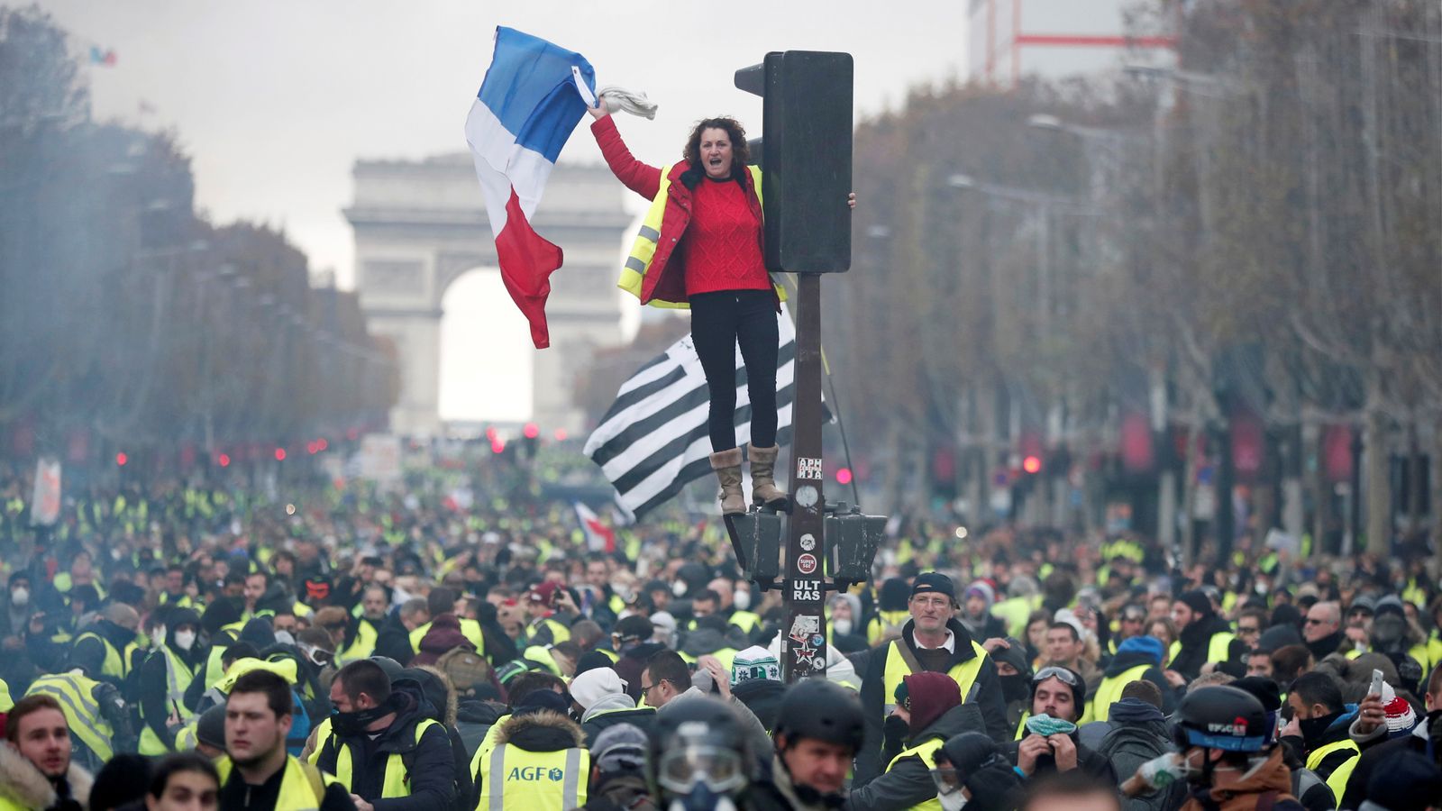 French government blames Marine Le Pen for violent Paris fuel protests