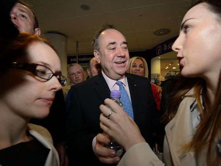 Scotland's First Minister Alex Salmond (C) hosting an event at Edinburgh airport in 2014
