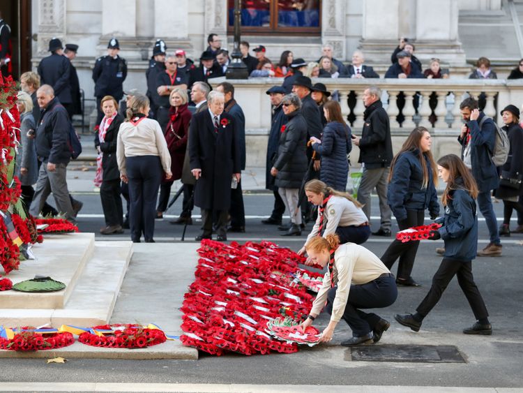 Wreaths are laid on behalf of the public as they make their way past the Cenotaph in The People&#39;s Procession