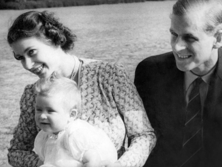PAR 14441-7 (-R).ROYAL RADIANCE.These pictures of eight year old Prince Charles and his Royal parents - Princess Elizabeth and the Duke of Edinburgh - are the most informal ever taken of the baby Prince and his youthful mother and father..These pictures are from a film made for the British Newsreels Association in the grounds of Windlesham Moor, country home in Surrey of Princess Elizabeth and the Duke..PICTURE SHOWS: Family life at its happiest expressed in radiant smiles of Princess Elizabeth, the Duke of Edinburgh and their infant son, Prince Charles..July 18th 1949 PAR 14441-7 (-R)