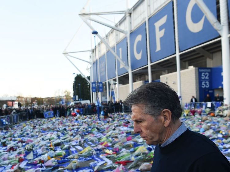 The  French manager Claude Puel looks at the floral tributes left to the victims