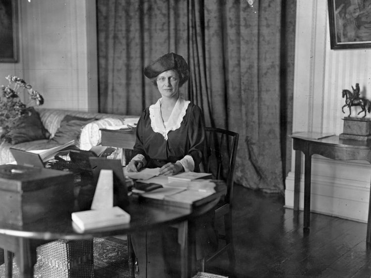 American-born British politician Nancy Witcher Langhorne, Viscountess Astor (1879 - 1964), Conservative candidate at the Plymouth election sitting at a worktable. She won the election and became the first woman member of parliament. (Photo by G. Adams/Topical Press Agency/Getty Images)