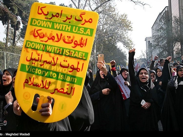 Iranian women gather to mark the anniversary of the seizure of the US Embassy