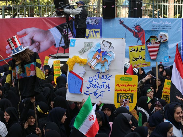 Iranian protesters demonstrate outside the former US embassy in the Iranian capital Tehran
