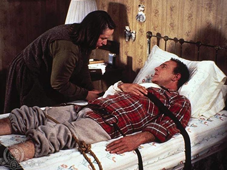 Kathy Bates and James Caan in Misery, written by Stephen King, screenplay by William Goldman