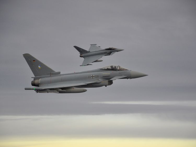 Two German Eurofighter jets simulate the interception of a plane over the Baltic sea during the drill