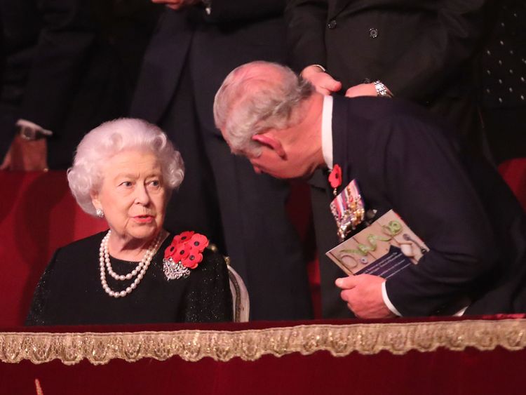 Prince Charles speaks with his mother at the concert
