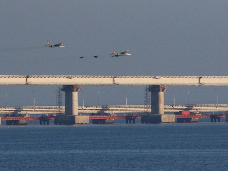 Russian jet fighters fly over a bridge connecting Russia with the Crimean peninsula