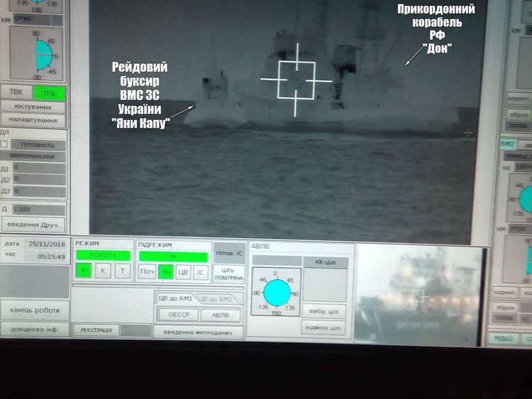 A Russian border guard vessel apparently tries to stop a Ukrainian navy tug boat. Pic: Ukrainian navy handout 