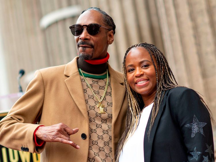 Rapper Snoop Dogg with his wife Shante Broadus attend the ceremony honoUring Snoop Dogg with a star on Hollywood Walk of Fame