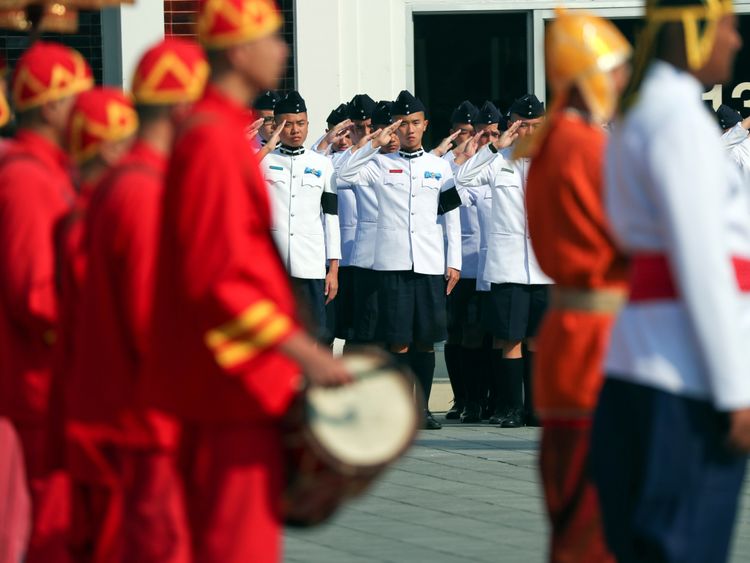 Royal soldiers attend a procession at the temple where the funeral of Vichai Srivaddhanaprabha