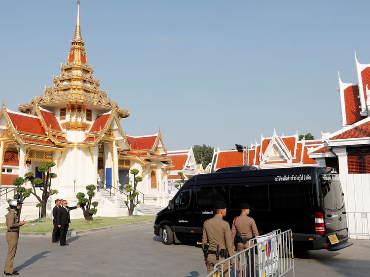 A vehicle carrying the body of Vichai Srivaddhanaprabha arrives at Wat Debsirindrawas temple