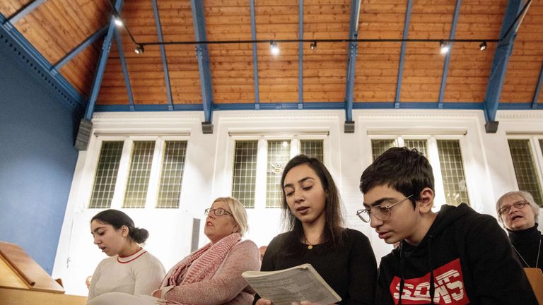 Armenian Hayarpi Tamrazyan and her brother Warduhi during a service in the Bethel church