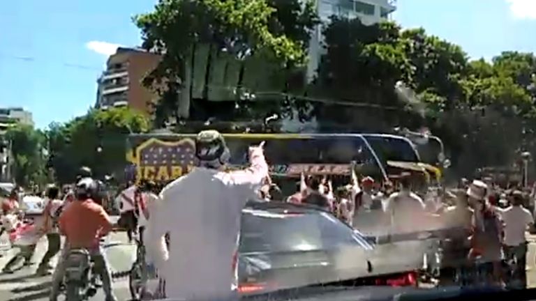A Boca Juniors bus is attacked by opposition fans