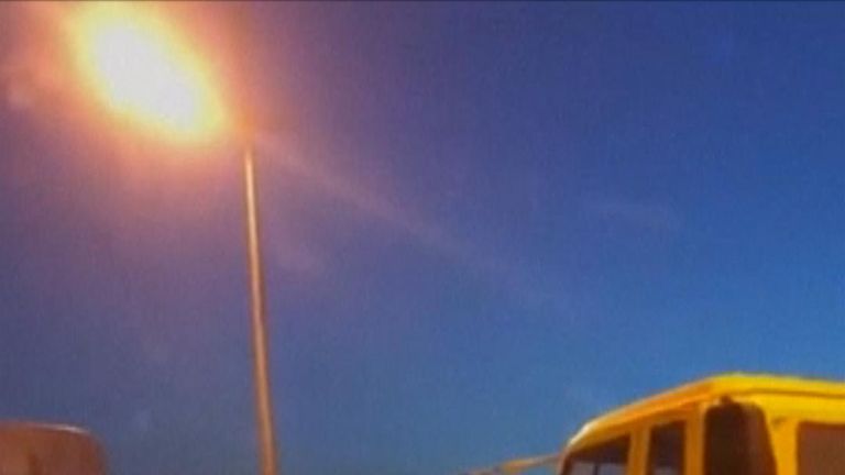 Four people went across a vehicle-only bridge disguised as a yellow bus, but their ruse was quickly discovered by local security.