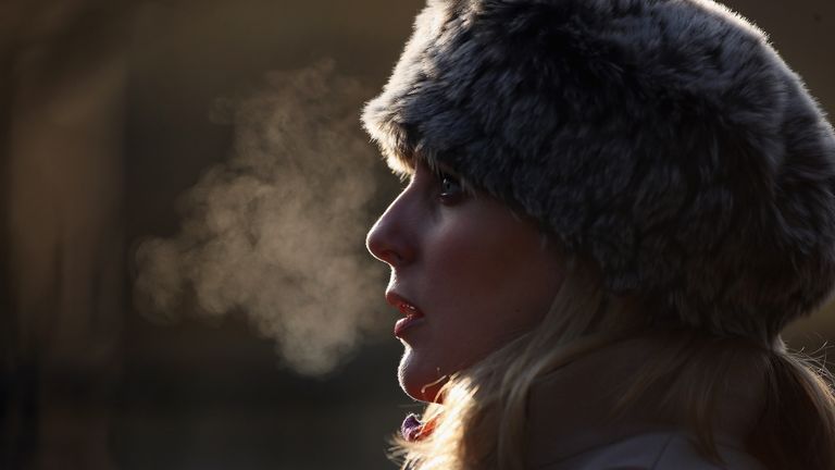 LONDON, ENGLAND - DECEMBER 12: A woman&#39;s breath is backlit on a freezing morning in Regents Park on December 12, 2012 in London, England. Forecasters have warned that the UK could experience the coldest day of the year so far today, with temperatures dropping as low as -14C, bringing widespread ice, harsh frosts and freezing fog. Travel disruption is expected with warnings for heavy snow in some parts of the country. (Photo by Dan Kitwood/Getty Images)
