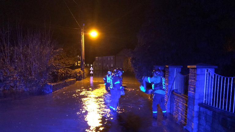 Police and firefighters attend a pub and a house after flooding in Milford Haven. Pic: Dyfed Powys police