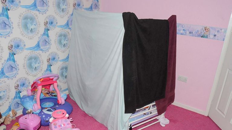 The bed was surrounded by sheets and bedding